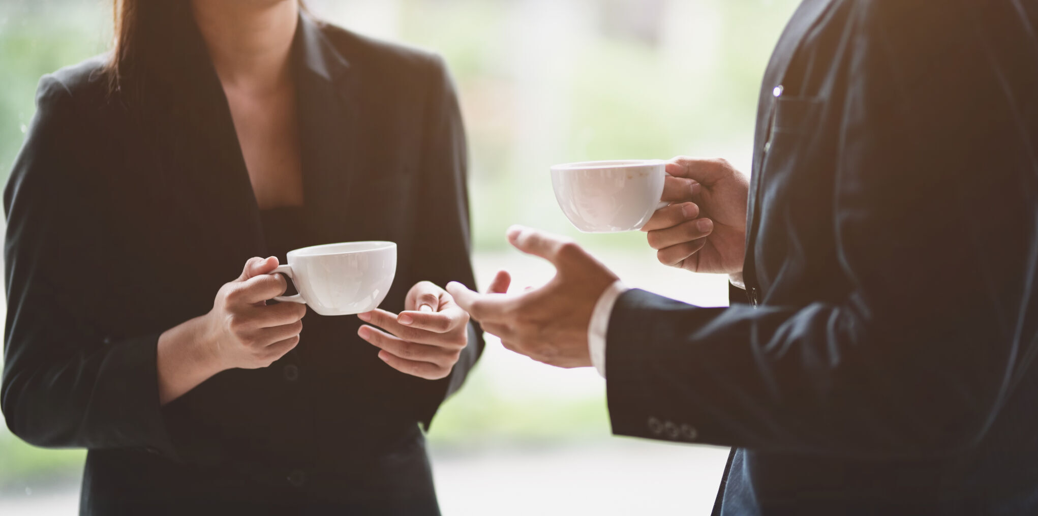 Business team discussing while having coffee break